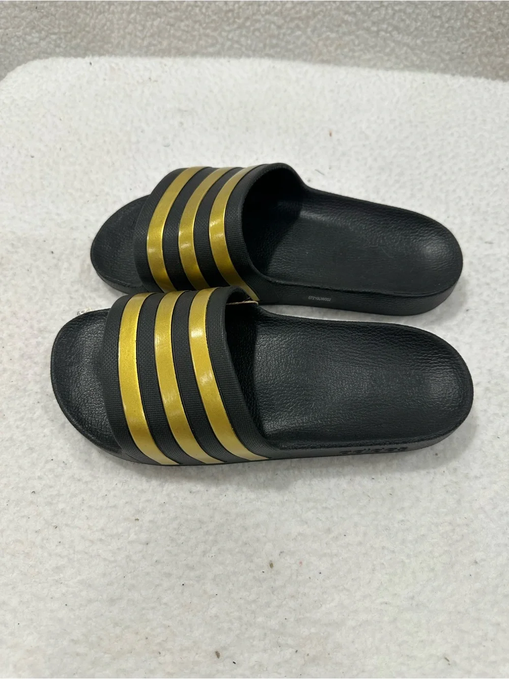 Adidas Black Slide Sandals with Gold Stripes
